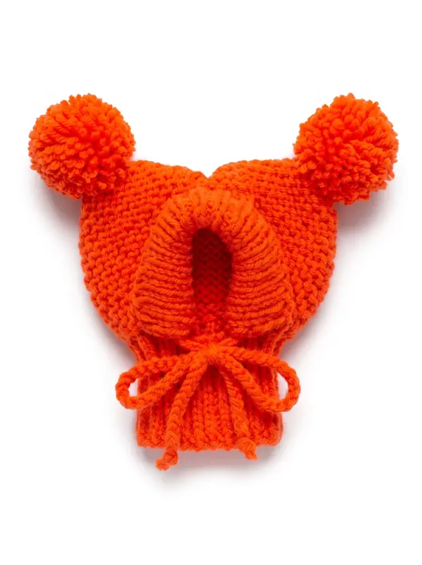Orange knitted dog hood with two pom-poms