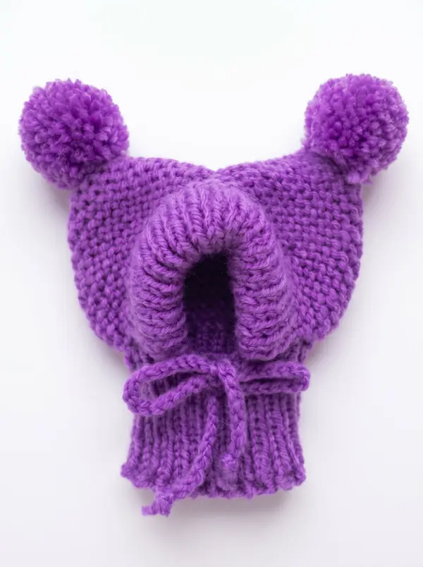 Purple knitted dog hood with two pom-poms